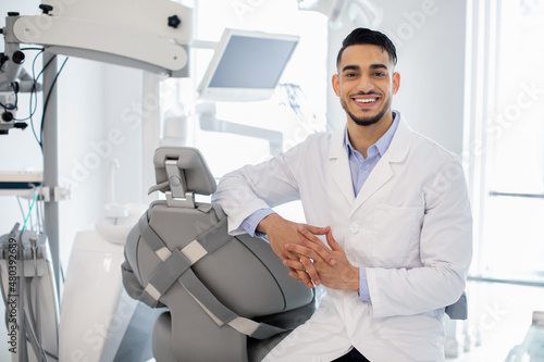 Dental Services. Portrait Of Professional Arab Stomatologist Doctor Posing At Workplace