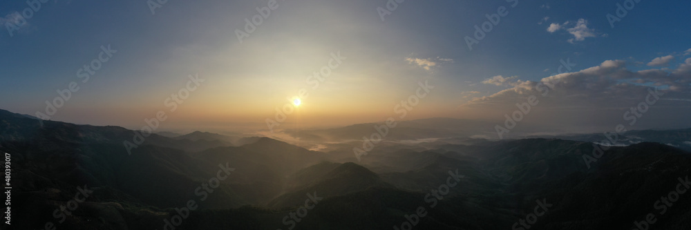 panoramic aerial landscape view morning sunlight blue sky and mountain range with fog in valley at chiang rai Thailand,