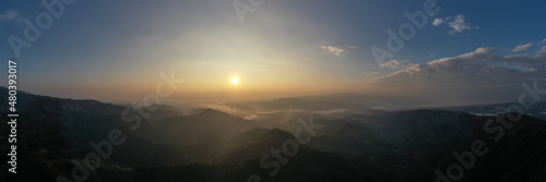 panoramic aerial landscape view morning sunlight blue sky and mountain range with fog in valley at chiang rai Thailand,