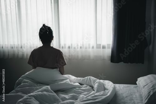 Wallpaper Mural Depressed asian woman has sad and lonely feel sitting on the bed in the morning. Torontodigital.ca