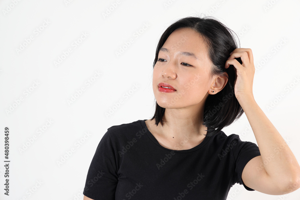 Young attractive south east asian woman pose face expression emotion on white background Young attractive south east asian woman pose face expression emotion on white background