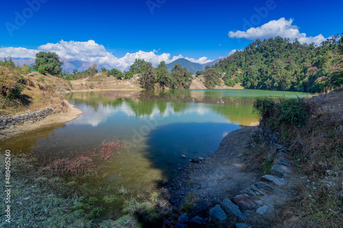 Deoria Tal , also Devaria or Deoriya is a high altitude lake in Uttarakhand, India. Blue sky with snow-covered mountains, Chaukhamba is one of them, in the background. photo