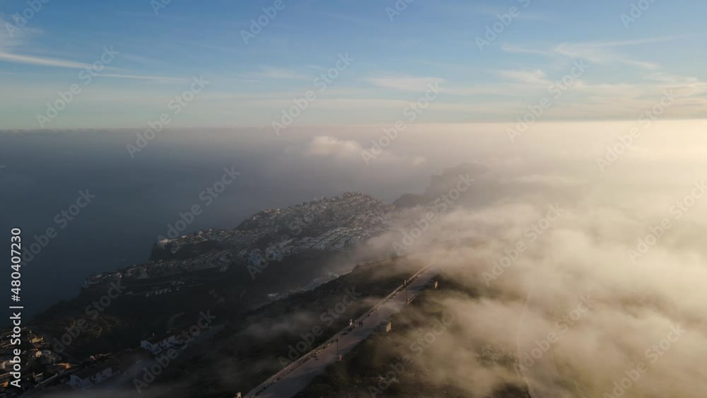 Fooggy sunset in Cumbre del sol. The fog hides the horizon and de coastline. Drone views from Benitachell, Moraira, Calpe and Jávea, in Alicante, Spain Fooggy sunset in Cumbre del sol. The fog hides the horizon and de coastline. Drone views from Benitachell, Moraira, Calpe and Jávea, in Alicante, Spain