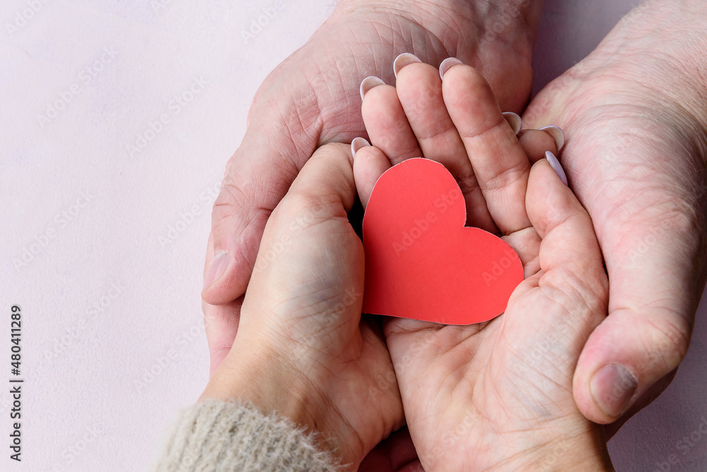 Valentine's Day background. Red hearts in your hand . Copy space. Valentine's Day background. Red hearts in your hand . Copy space.