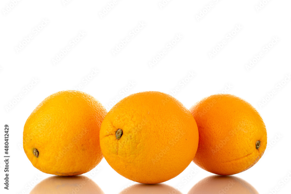 Three juicy oranges, macro, isolated on white. Three juicy oranges, macro, isolated on white.