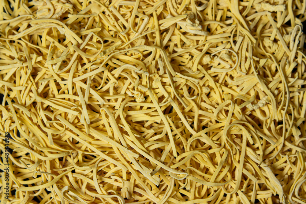 Egg noodles in full screen. Dry homemade noodles. Traditional pasta Egg noodles in full screen. Dry homemade noodles. Traditional pasta