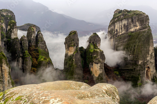Orthodox monasteries of Meteora (Greece) on the rocks shrouded in fog © TETYANA