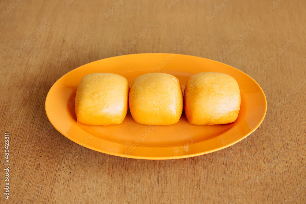 Mantou, a Chinese Steamed Buns dessert isolated on wood table top view sweet