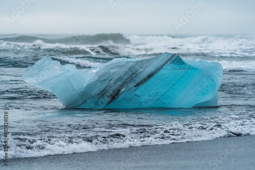 Spectacular deep blue iceberg in diamond beach photo