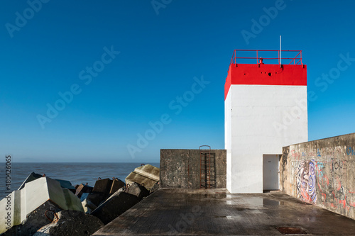 Farol no dique da praia do Digue em Boucau photo