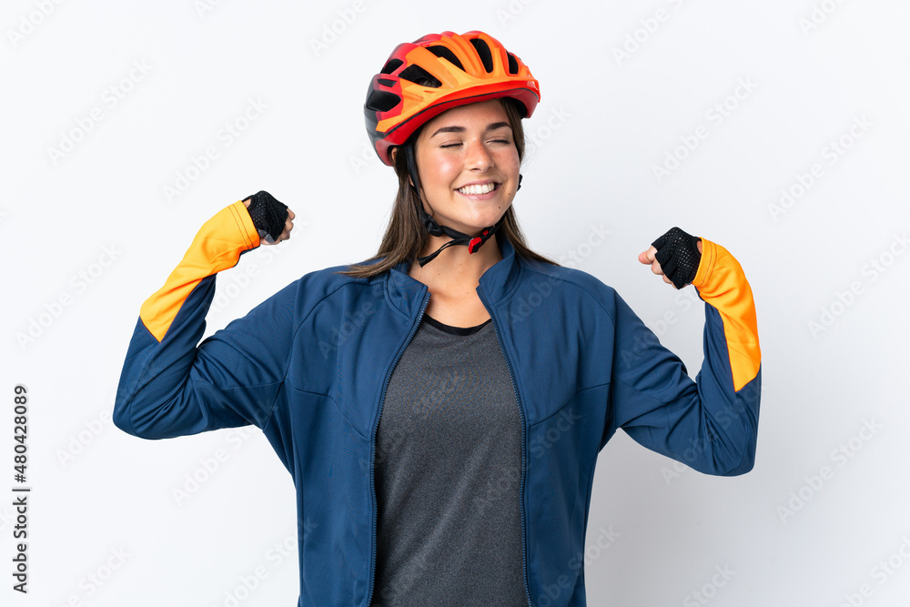 Young cyclist brazilian girl isolated on white background doing strong gesture Young cyclist brazilian girl isolated on white background doing strong gesture