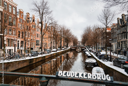 View from the Beudekerbrug bridge over the Leidsegracht Canal in the historic city center of Amsterdam photo