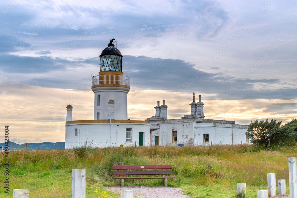 view of Chanonry Point Lighthouse at sunset in summer in Higlands of Scotland.