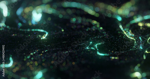 Beautiful dots in motion, texture with glowing defocused particles. Shallow depth of field. 