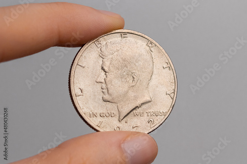 Cuadro en lienzo A hand holds a coin of 50 american cents with a portrait of John F