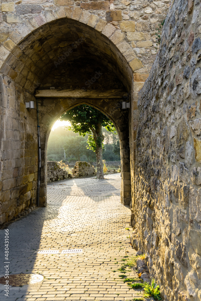 Sunset at the gates of a medieval wall