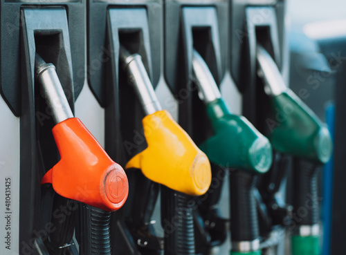 Photo of fuel distributor guns, gasoline, diesel oil.