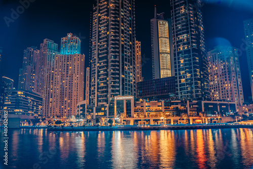 Fantastic nighttime skyline with illuminated skyscrapers. Dubai  UAE