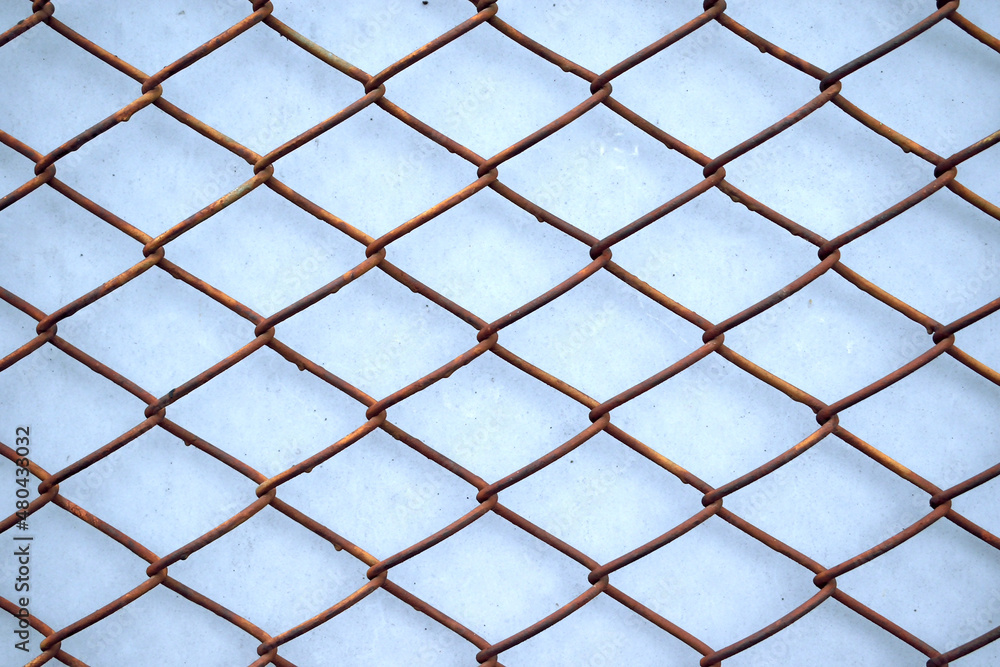 Fototapeta premium mesh with rhombuses on a blue background, close-up as a texture for the background