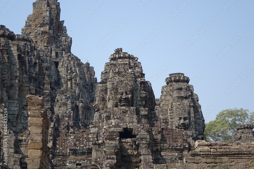 Adventure of exploring mystic Bayon temple in the impressive Khmer ruin city Angkor Thom (horizontal image), Siem Reap, Cambodia