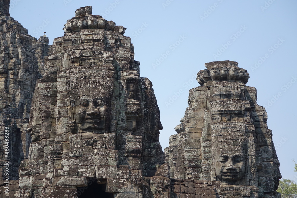 Adventure of exploring mystic Bayon temple in the impressive Khmer ruin city Angkor Thom (horizontal image), Siem Reap, Cambodia