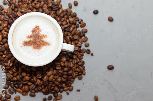 one cup of coffee cappuccino with herringbone on a concrete background with copy space