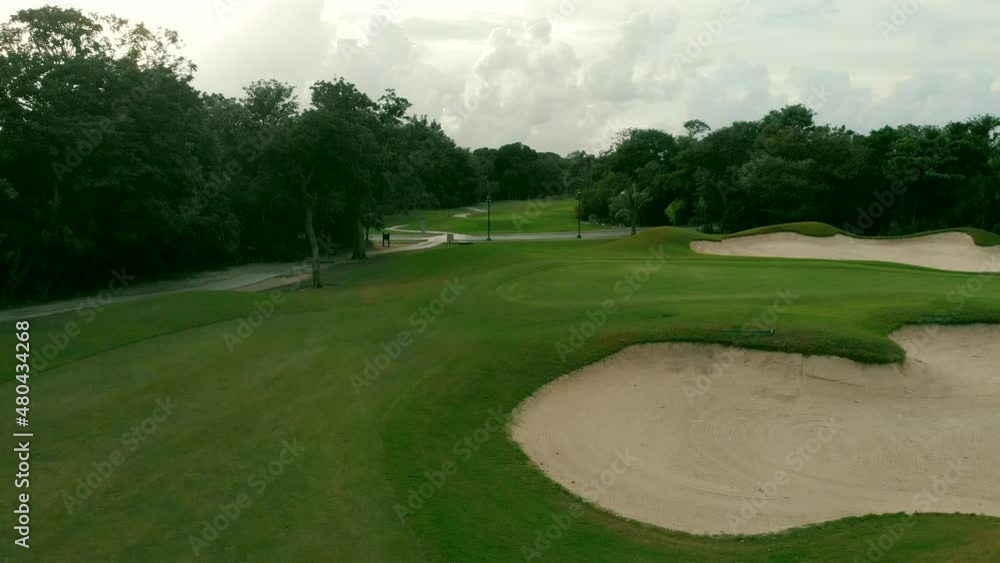 Aerial top view of golf field in Mexico. Fly forward. Bird view over Golf course in tropical. High quality 4k footage Aerial top view of golf field in Mexico. Fly forward. Bird view over Golf course in tropical. High quality 4k footage