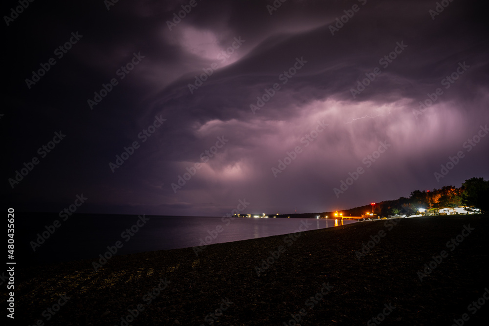 Lightning over the sea at night in the south