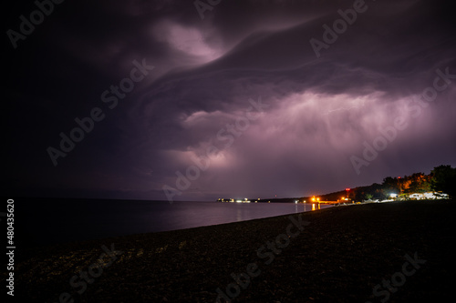 Obraz na płótnie Lightning over the sea at night in the south w salonie
