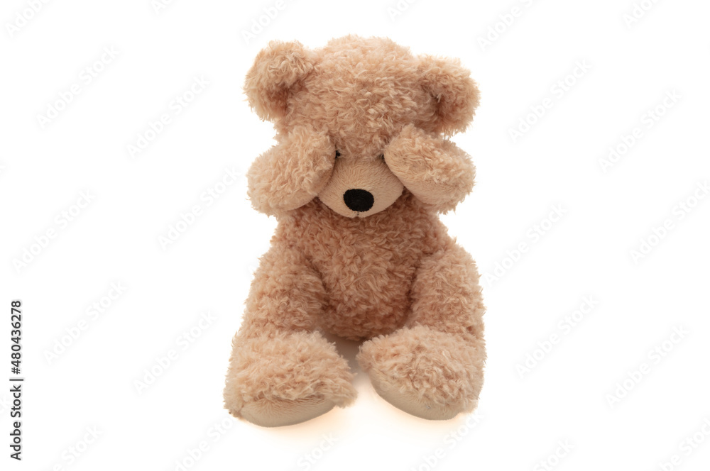Child abuse concept. Teddy bear cover eye isolated on white background