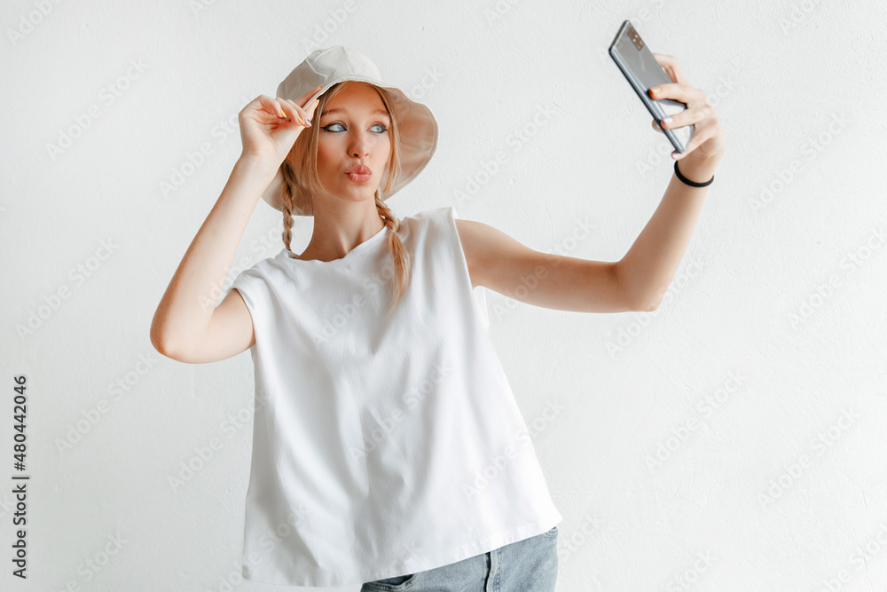 Cheerful attractive woman making a selfie photo for a friend Cheerful attractive woman making a selfie photo for a friend