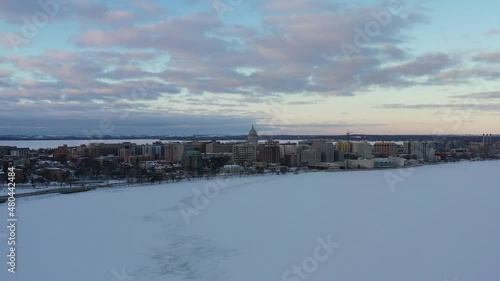 Madison, Wisconsin in Winter Over Lake Monona (Drone - Pull-Back & Tilt Down) 