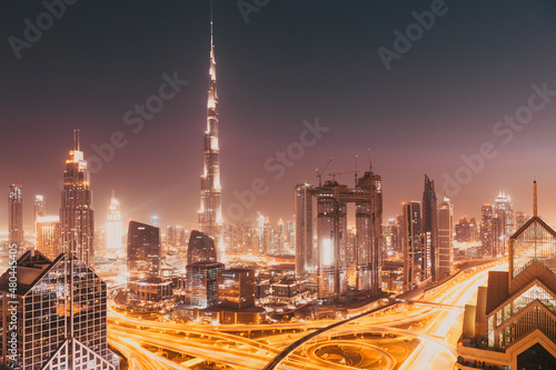 DUBAI, UAE - FEBRUARY 2018: Dubai skyline at sunset with Burj Khalifa, the world tallest building and Sheikh Zayed road traffic