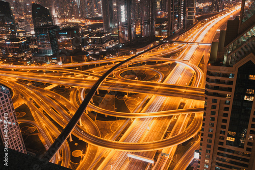 DUBAI, UAE - FEBRUARY 2018: Night traffic on a busy intersection on Sheikh Zayed highway