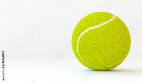 Realistic 3D tennis ball with copy space. Sport ball for big tennis. Horizontal banner. 3D render illustration isolated on white background.	
 photo