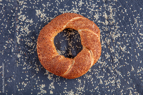 Sesame seeds and simit on a black background. Turkish Bagels.