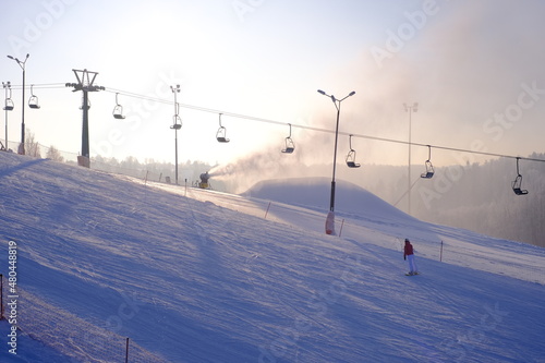 Snow-covered trees in hoarfrost at a ski resort, snow cannon, ski lift, funicular, 