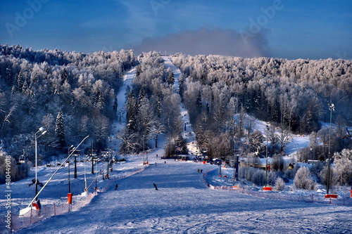 Snow-covered trees in hoarfrost at a ski resort  lift  funicular  ski lift