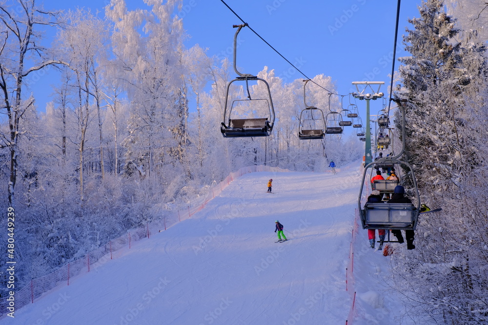Snow-covered trees in hoarfrost at a ski resort, lift, funicular, ski lift Snow-covered trees in hoarfrost at a ski resort, lift, funicular, ski lift