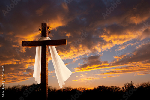 This dramatic sunrise lighting and Easter Cross makes a great Easter photo illustration of Jesus dying on the cross and rising again. © ricardoreitmeyer