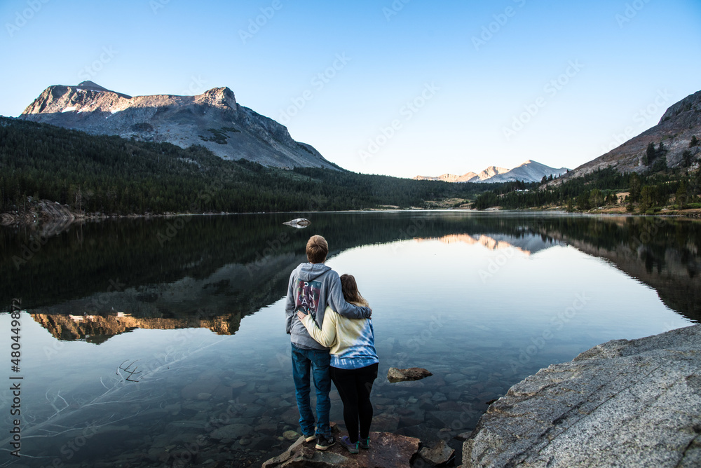 Fototapeta premium Couple In Love Watching Mountain Sunrise in Yosemite National Park After Hike