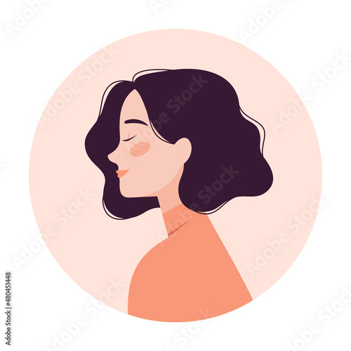 Portrait of a beautiful young woman with short wavy hair