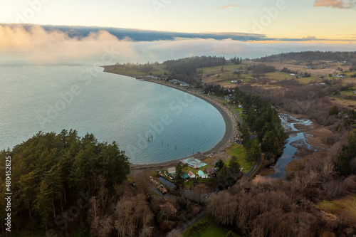 Sunset Over Legoe Bay on Lummi Island, Washington. Home to the famous Willows Inn this gem of an island is only a short ferry ride across Hales Pass in the Salish Sea of western Washington state. photo