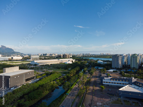 Aerial view of Jacarépagua in Rio de Janeiro, Brazil. Residential buildings and mountains in the background. Sunny day. Sunset Drone photo