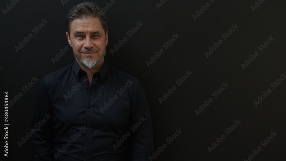 Confident businessman smiling. Portrait of mature age, middle age, mid adult man in 50s, happy confident smile. Copyspace. Confident businessman smiling. Portrait of mature age, middle age, mid adult man in 50s, happy confident smile. Copyspace.