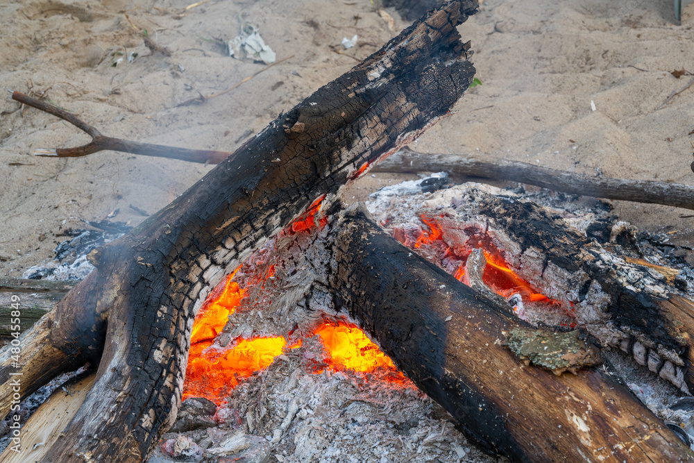Flames from a bonfire at night. Adventure traveling lifestyle. Concept wanderlust. Active weekend vacations wild nature outdoor. Flames from a bonfire at night. Adventure traveling lifestyle. Concept wanderlust. Active weekend vacations wild nature outdoor.