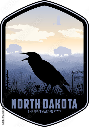Fotografie, Obraz North Dakota vector label with western meadowlark and bisons in grassland prarie