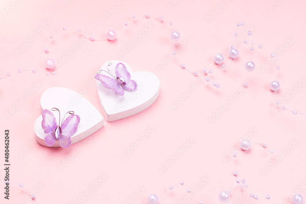 Two white hearts with butterflies on a pink background.Valentine s day concept.Greeting card. Love concept