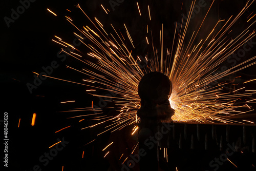 Принти на полотні Splashes of sparks when welding a structure on a smithy