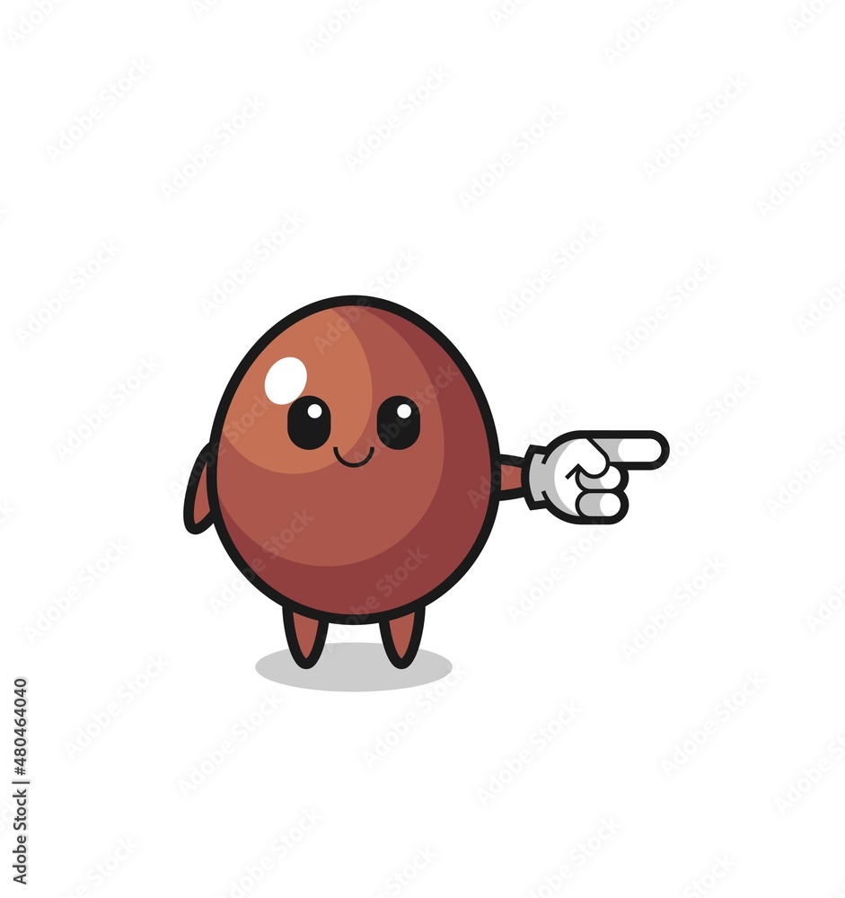 chocolate egg mascot with pointing right gesture chocolate egg mascot with pointing right gesture